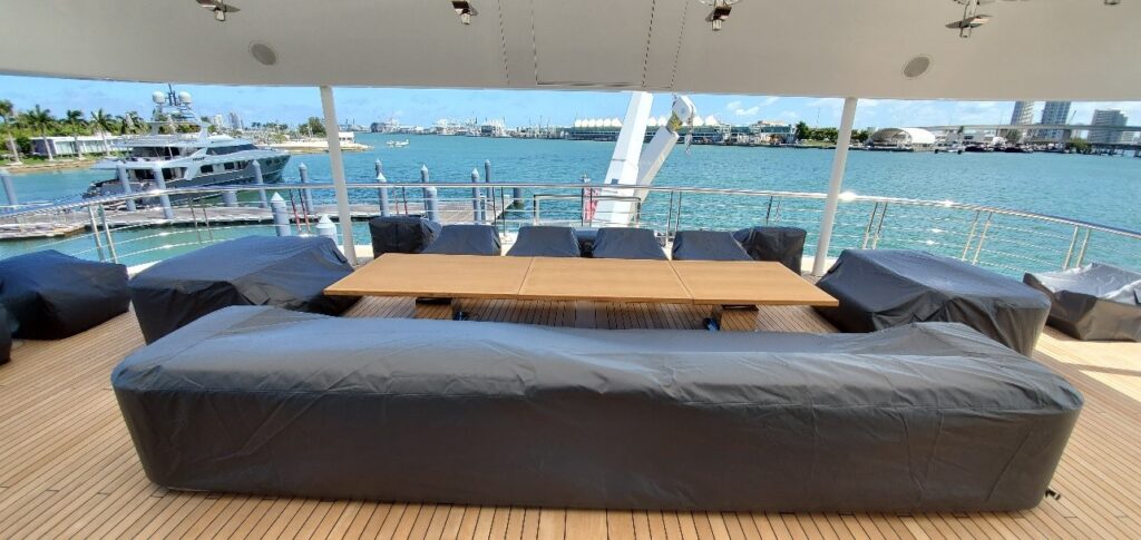 Yacht furnishing covered with a black water poof weather cover