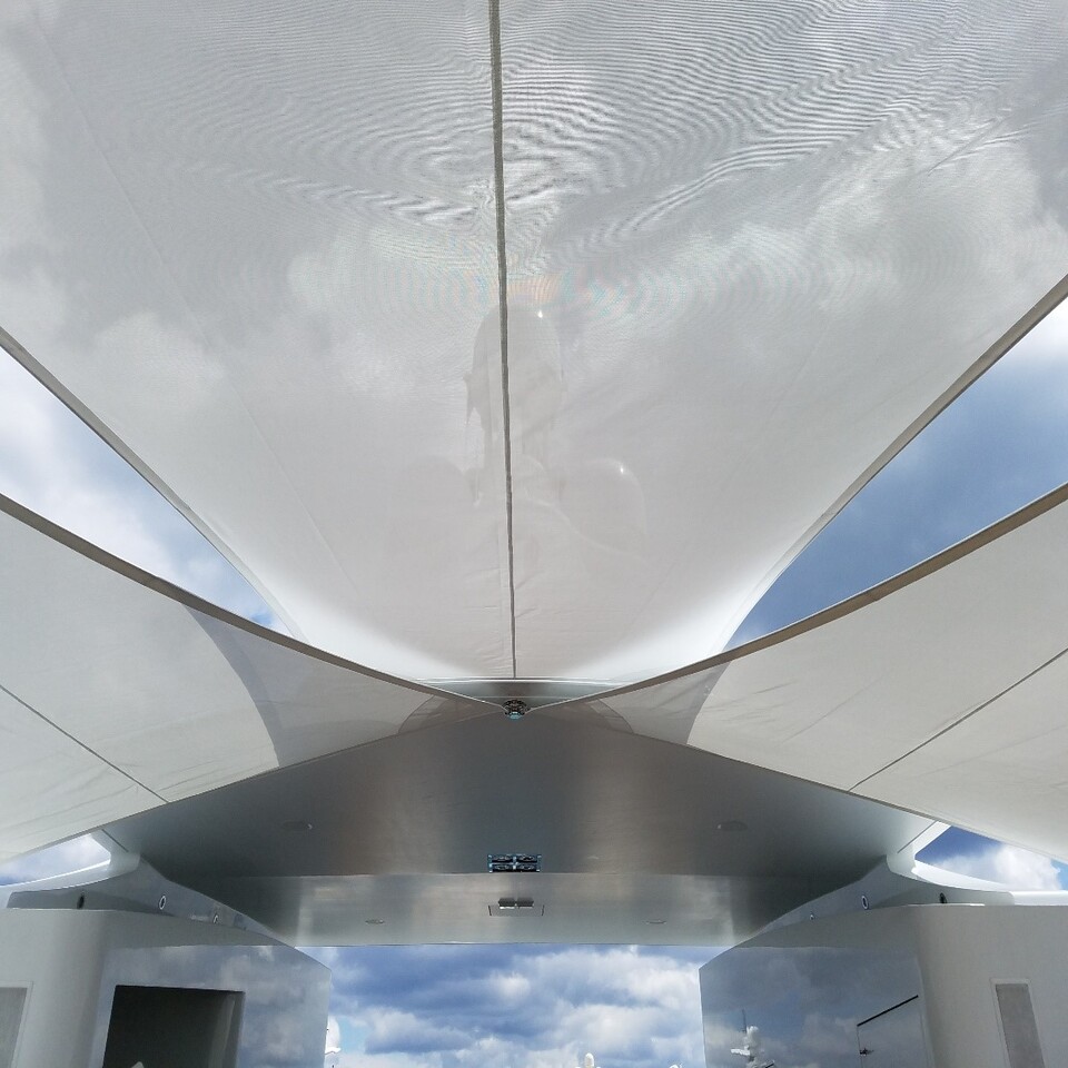 Wide sail awnings on large superyacht
