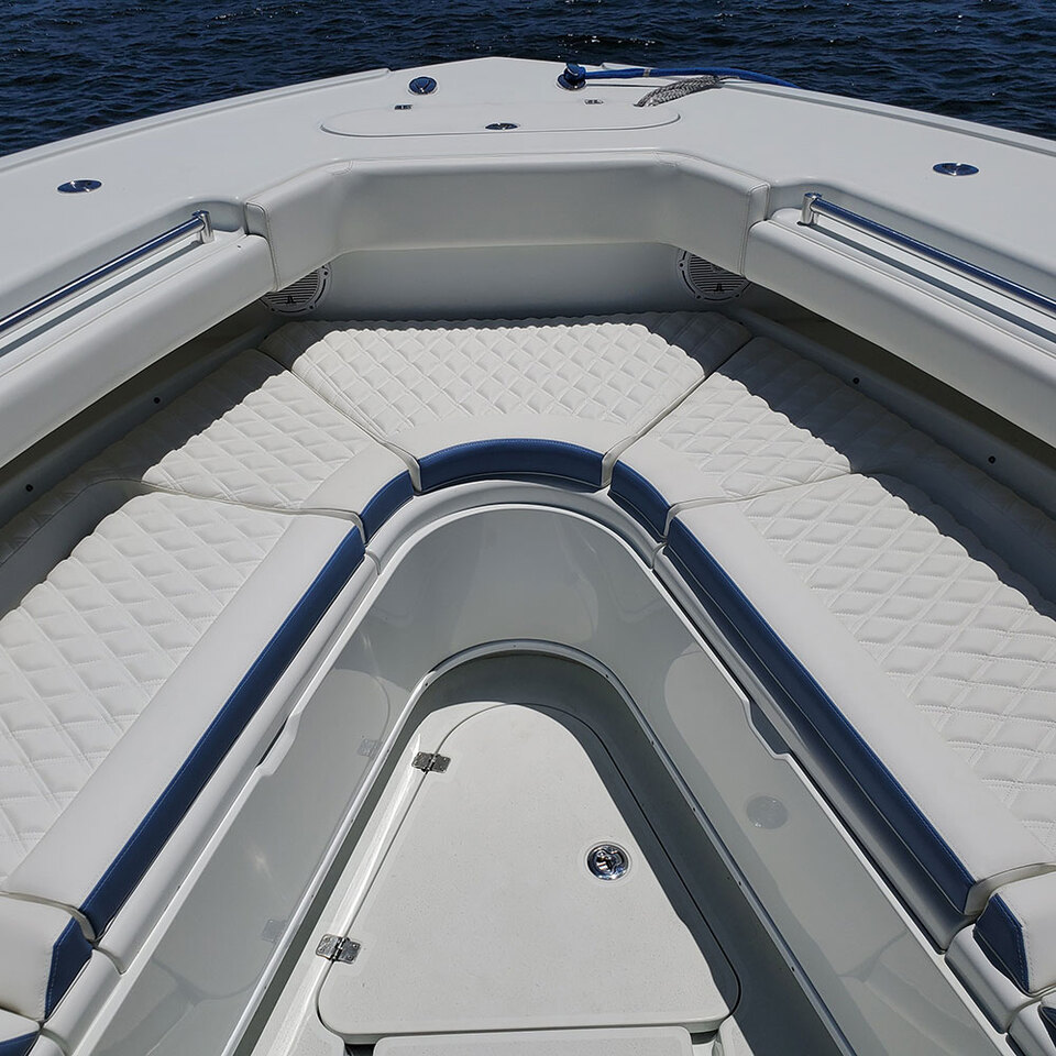 White leather yacht cushions with blue trim