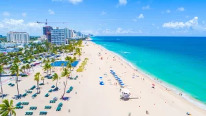 South Florida beach with blue ocean and beachgoers