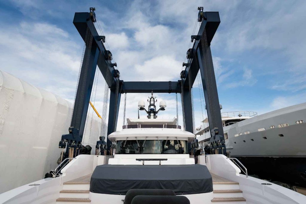 White superyacht being lift out the water by yacht lift