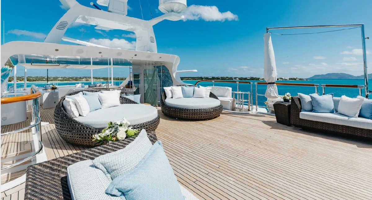 Yacht deck with two yacht chairs, upholstery and cushions.