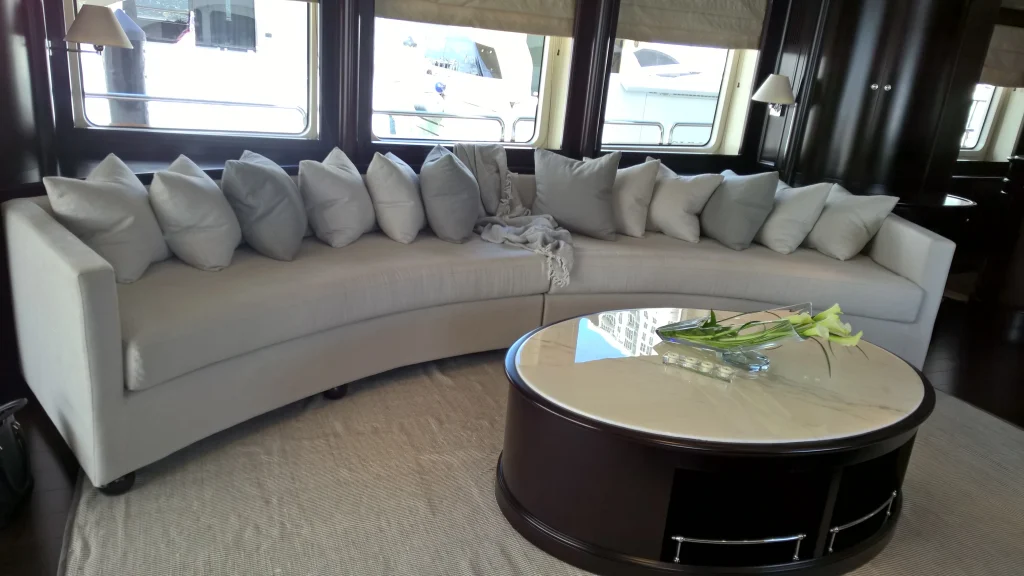 Previous yacht sofa with cushions and square corners.