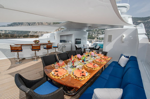 fully set table on a yacht deck