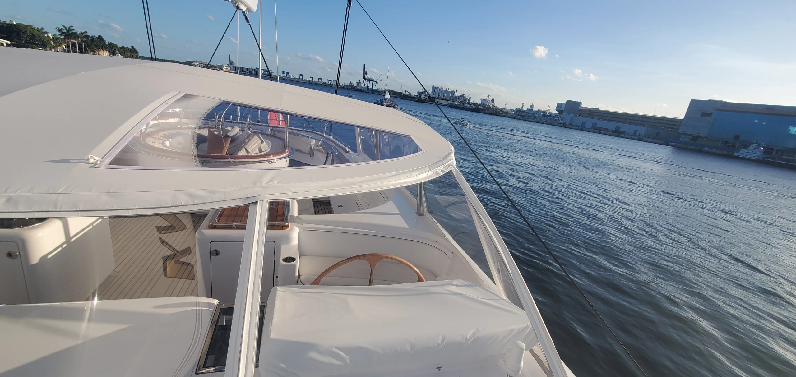 Clear view of the ocean and sun from the Bimini of a superyacht.
